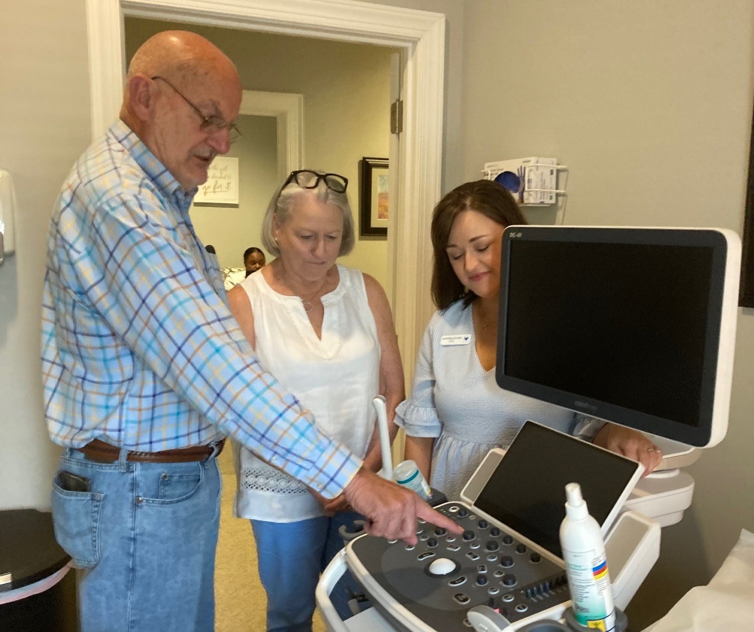 Crisis pregnancy centers across Georgia are ready to assist women in the wake of the Roe v. Wade reversal. In this photo, Moultrie Pastor Stanley Norman, his wife Nancy, center, and Hope House director Katrina Bivins take a look at the new ultrasound machine at the crisis pregnancy center in Moultrie. (Index/Roger Alford)