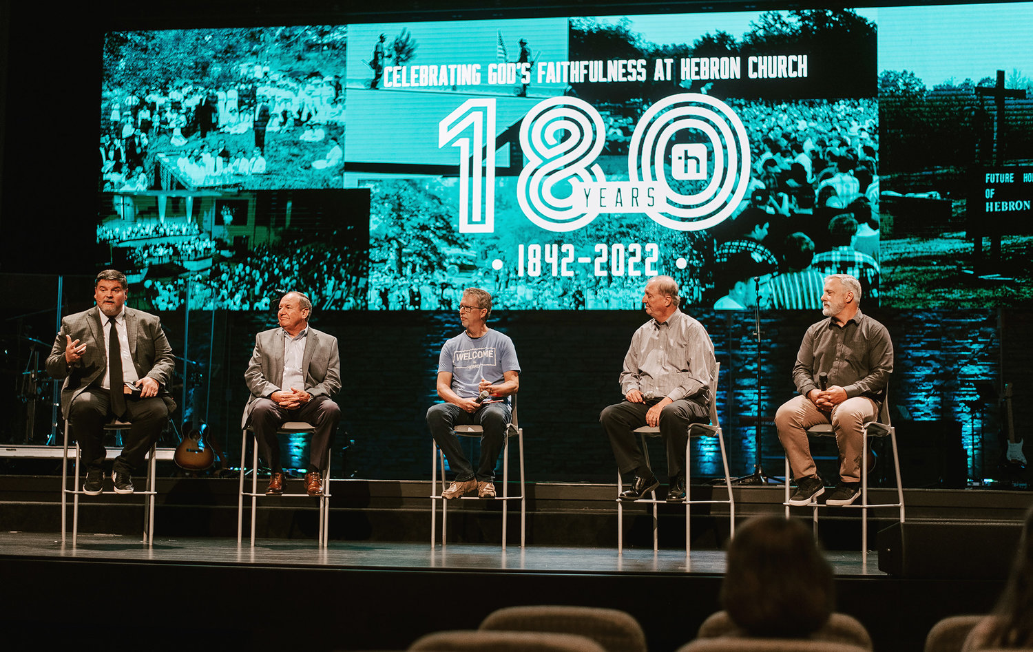 Pastor Landon Dowden speaks during a panel discussion Sunday, July 3, 2022, on the 180th anniversary of Hebron Baptist Church in Dacula, Ga., From left: Dowden, former Pastor Larry Wynn (1978-2011), Associate Pastor John Williams, former Interim Pastor Steve Parr (2018) and former Pastor Kevin Miller (2011-2017). (Photo/Hebron Baptist Church)