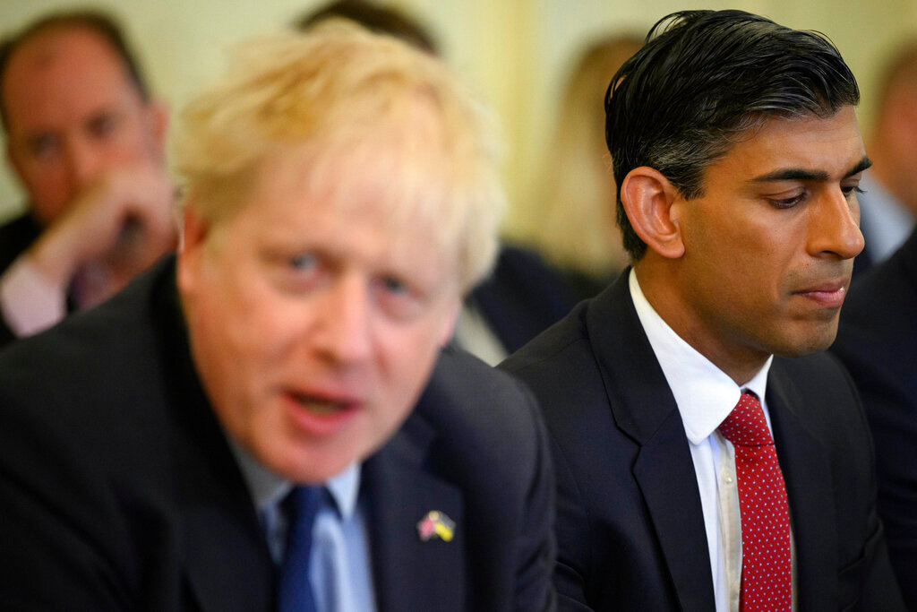 Britain's Chancellor Rishi Sunak, right, listens as Britain's Prime Minister Boris Johnson addresses his Cabinet during his weekly Cabinet meeting in Downing Street, June 7, 2022 in London. (Leon Neal/Pool Photo via AP, File)