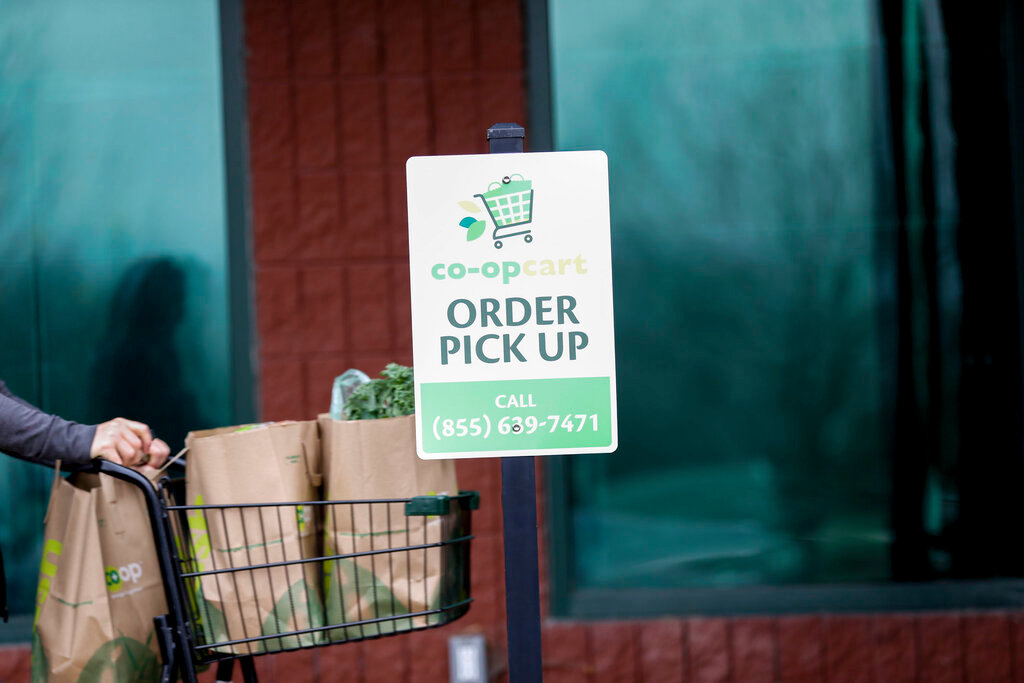 An order pickup station is seen at New Pioneer Co-Op in Coralville, Iowa, March 20, 2020. (Rebecca F. Miller/The Gazette via AP, File)