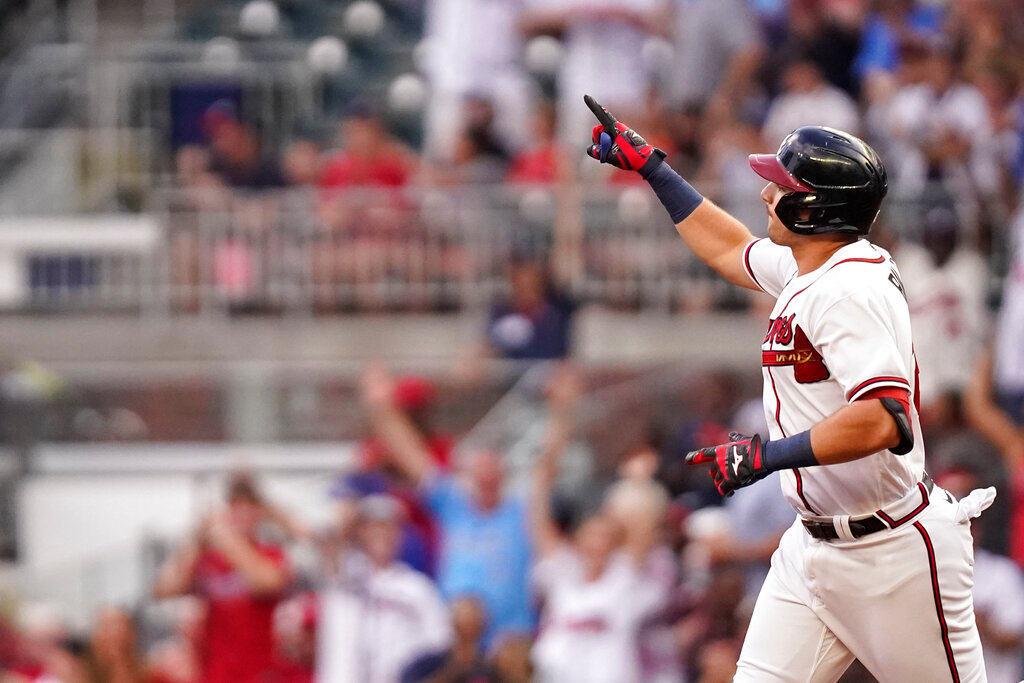 Atlanta Braves' Austin Riley celebrates after hitting a two-run home run against the St. Louis Cardinals during the first inning Tuesday, July 5, 2022, in Atlanta. (AP Photo/Brynn Anderson)