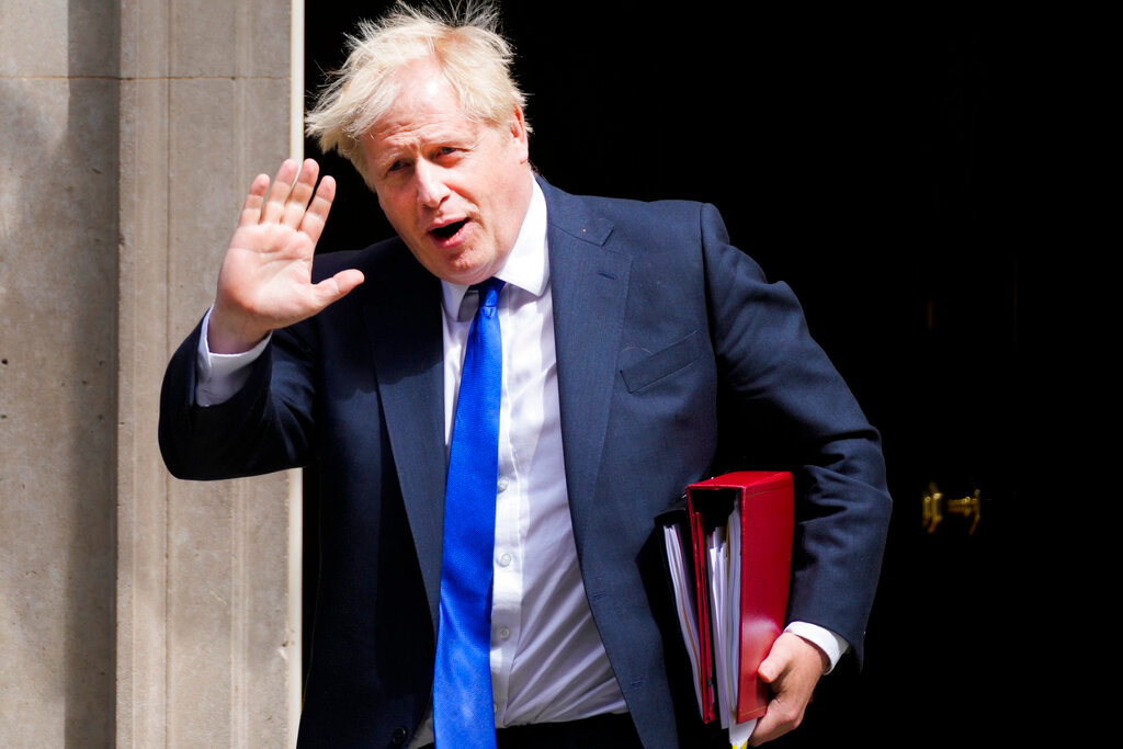 British Prime Minister Boris Johnson waves as he leaves 10 Downing Street in London, Wednesday, July 6, 2022.  (AP Photo/Frank Augstein)