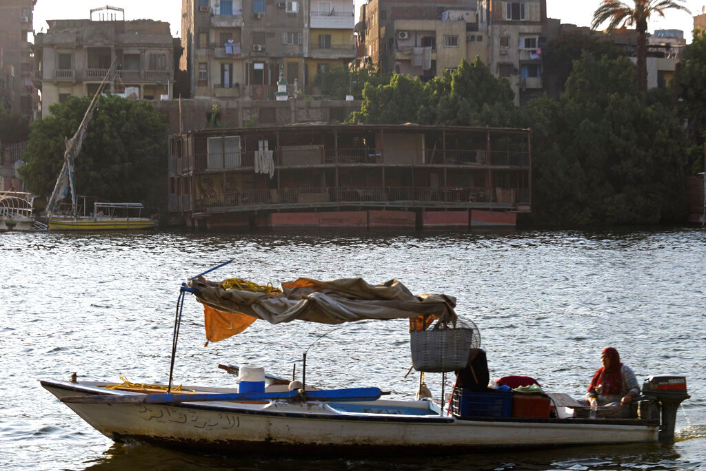 A partially demolished houseboat sits on the banks of the Nile River after being moved from its moorings on July 1, 2022. (AP Photo/Tarek Wagih)