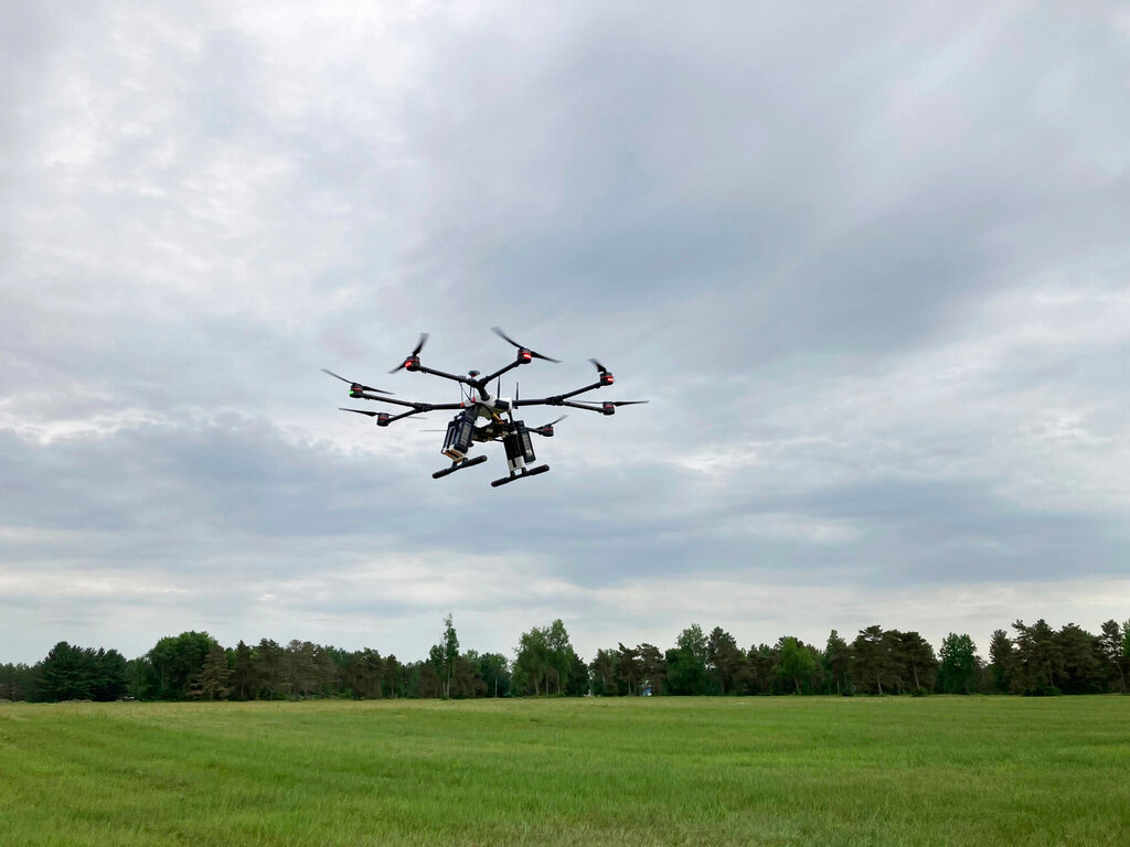 A drone flies at one of the Federal Aviation Administration’s designated drone testing sites run by nonprofit Northeast UAS Airspace Integration Research Alliance Inc., at Griffiss International Airport in Rome, N.Y., on June 11, 2021.  (AP Photo/Matt O’Brien)