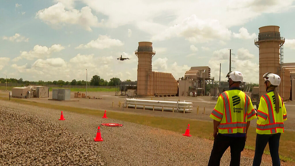 In this image from video, Dominion Energy drone operators fly a drone to inspect areas of a power plant in Remington, Va., on June 8, 2022. (AP Photo/Nathan Ellgren)