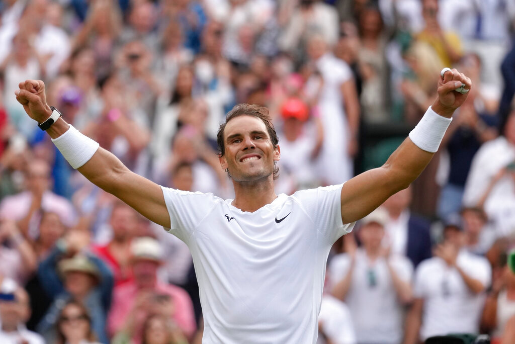 Spain's Rafael Nadal celebrates after beating Taylor Fritz of the US in a men's singles quarterfinal match at the Wimbledon tennis championships in London, Wednesday, July 6, 2022. (AP Photo/Kirsty Wigglesworth)