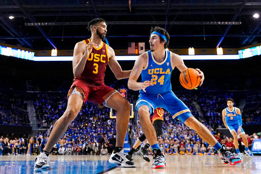 UCLA guard Jaime Jaquez Jr., right, tries to get past Southern California forward Isaiah Mobley during the second half of an NCAA college basketball game on March 5, 2022, in Los Angeles. (AP Photo/Mark J. Terrill, File)