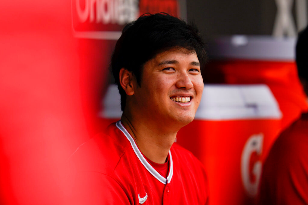 Los Angeles Angels designated hitter Shohei Ohtani sits in the dugout during the fourth inning against the Baltimore Orioles, Sunday, July 10, 2022, in Baltimore. (AP Photo/Julio Cortez)