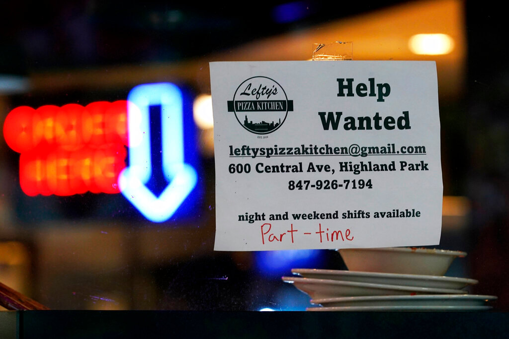 A help wanted sign is displayed at a restaurant in Highland Park, Ill., Thursday, July 14, 2022. (AP Photo/Nam Y. Huh, File)