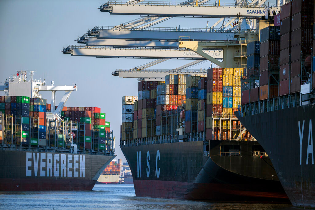 Container ship Ever Far, left, sails downriver past the Georgia Ports Authority's Port of Savannah in Savannah, Ga., Sept. 29, 2021. (AP Photo/Stephen B. Morton, File)