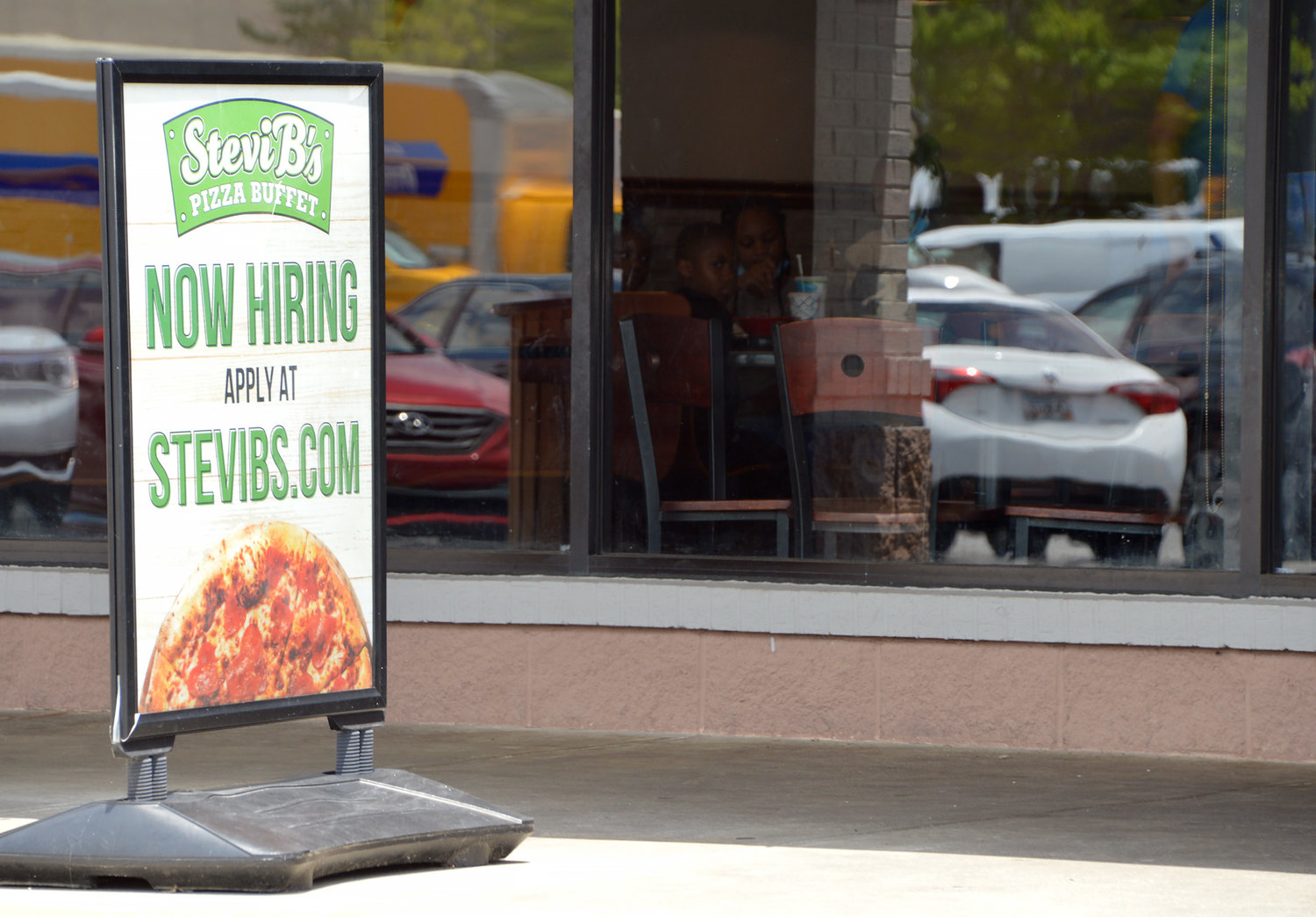 A hiring sign stands outside a Stevi B's restaurant in Hiram, Ga., July 8, 2022. (Christian Index/Henry Durand, File)