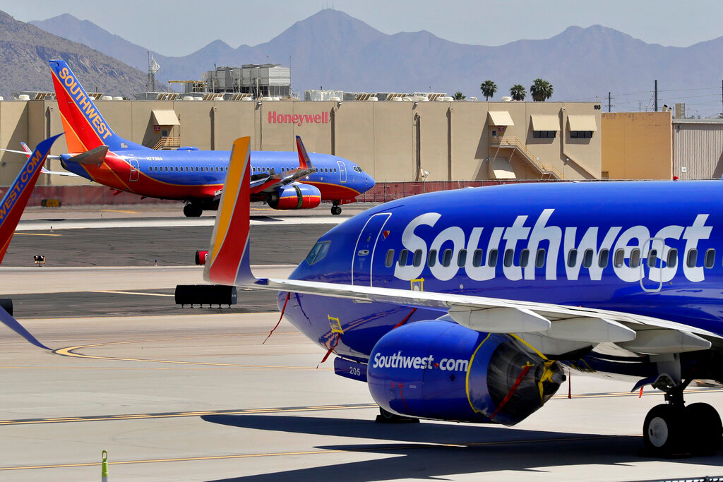 Southwest Airlines jets are parked at Sky Harbor International Airport in Phoenix, Tuesday, April 28, 2020. (AP Photo/Matt York, File)