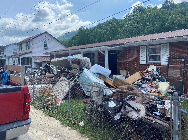 Soggy mattresses and other home furnishes are piled high in yards in Jenkins, Ky., where Georgia Baptist Disaster Relief volunteers are helping residents recover from flash flooding. (Georgia Baptist Disaster Relief/Dwain Carter)