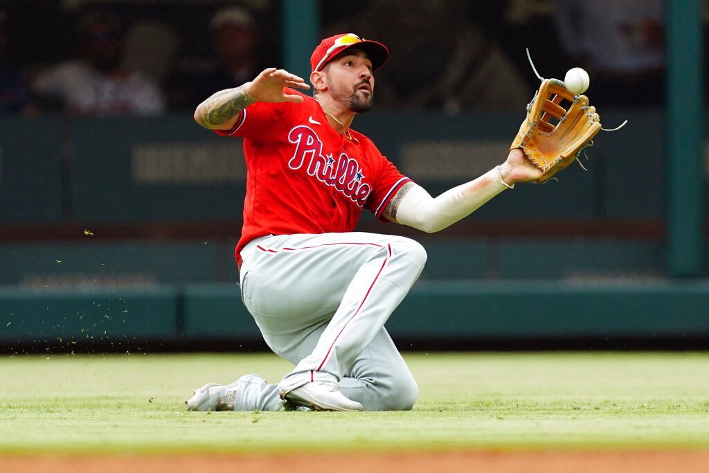 Philadelphia Phillies right fielder Nick Castellanos catches a fly ball from Atlanta Braves' William Contreras in the second inning Wednesday, Aug. 3, 2022, in Atlanta. (AP Photo/John Bazemore)