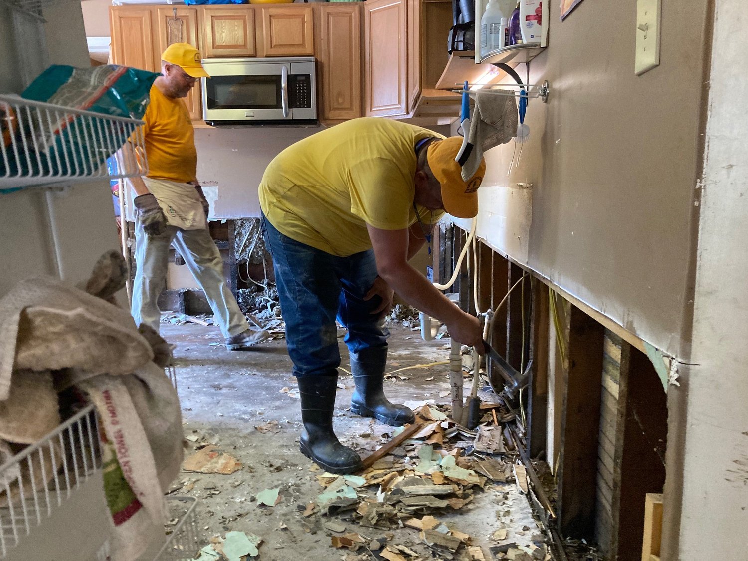 Georgia Baptist Disaster Relief workers remove soggy drywall from a home in eastern Kentucky on Wednesday, August 3, 2022.