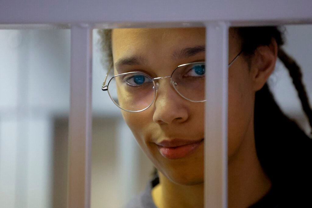 WNBA star and two-time Olympic gold medalist Brittney Griner stands in a cage in a courtroom prior to a hearing in Khimki just outside Moscow, Thursday, Aug. 4, 2022. (Evgenia Novozhenina/Pool Photo via AP)