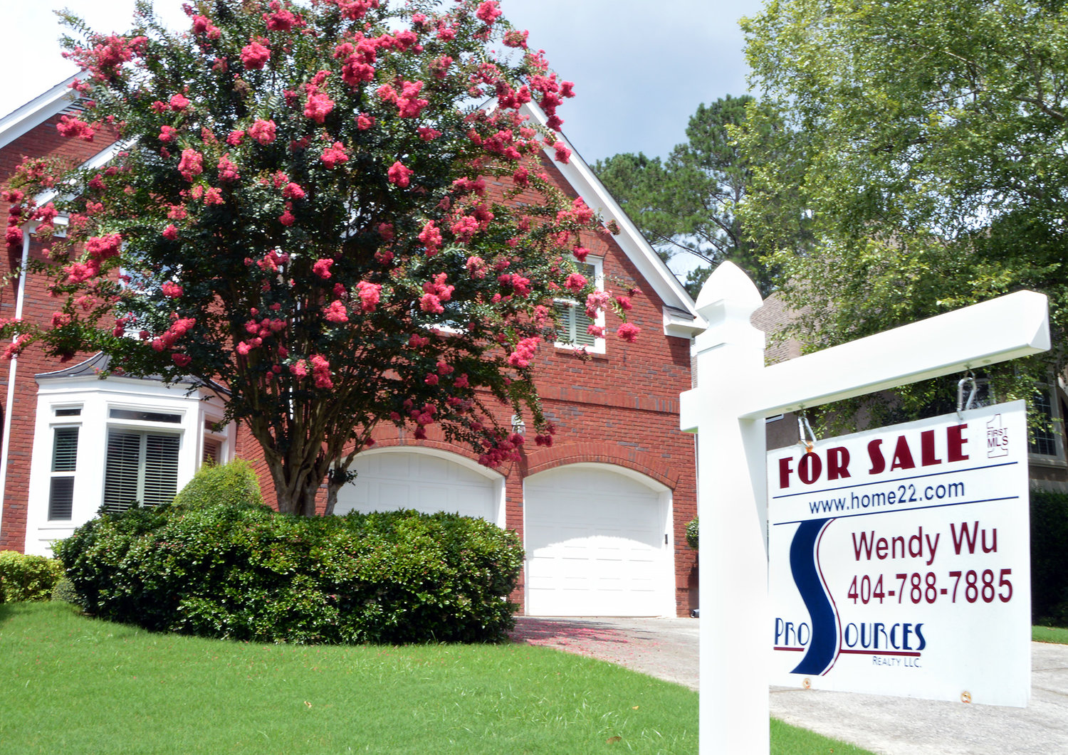 A "For Sale" sign stands in front of a home in Marietta, Ga., July 20, 2022. (Christian Index/Henry Durand, File)