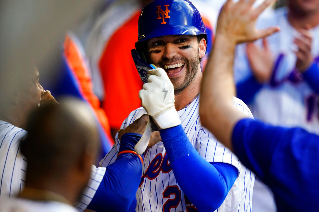 New York Mets' Tyler Naquin celebrates with teammates after hitting a home run during the second inning against the Atlanta Braves on Thursday, Aug. 4, 2022, in New York. (AP Photo/Frank Franklin II)