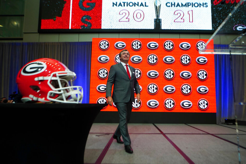 Georgia head coach Kirby Smart steps to the podium to speak during NCAA college football Southeastern Conference Media Days, July 20, 2022, in Atlanta. (AP Photo/John Bazemore, File)