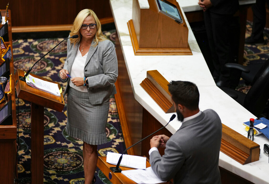 Republican Rep. Wendy McNamara, left, listens to questions from Republican Rep. Matt Hostettler, right, before a vote is held on Senate Bill 1 during a special session Friday, Aug. 5, 2022, at the Indiana Statehouse in Indianapolis. (Jenna Watson/The Indianapolis Star via AP)