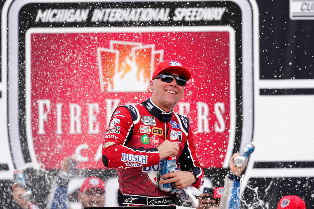Kevin Harvick celebrates after winning the NASCAR Cup Series race at the Michigan International Speedway in Brooklyn, Mich., Sunday, Aug. 7, 2022. (AP Photo/Paul Sancya)