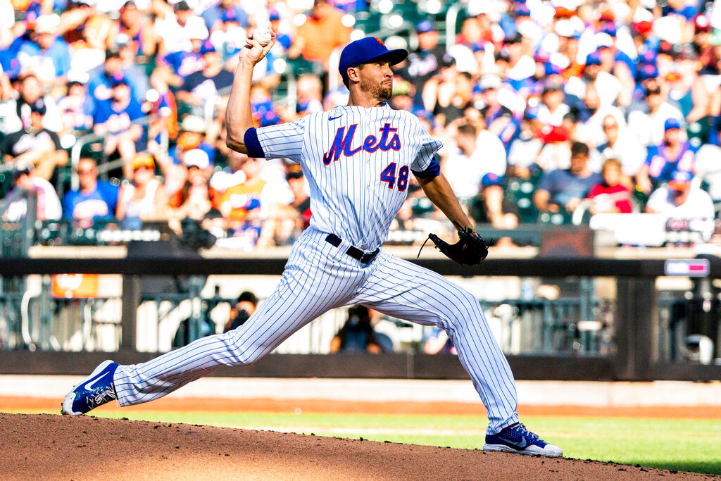 New York Mets starting pitcher Jacob deGrom throws during the second inning against the Atlanta Braves, Sunday, Aug. 7, 2022, in New York. (AP Photo/Julia Nikhinson)