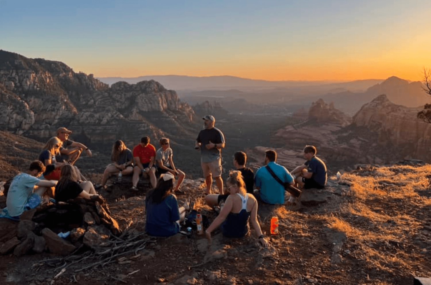 Pastor Josh Jennings of Aletheia Church in Sedona, Ariz. delivers a sunset devotional with college students.