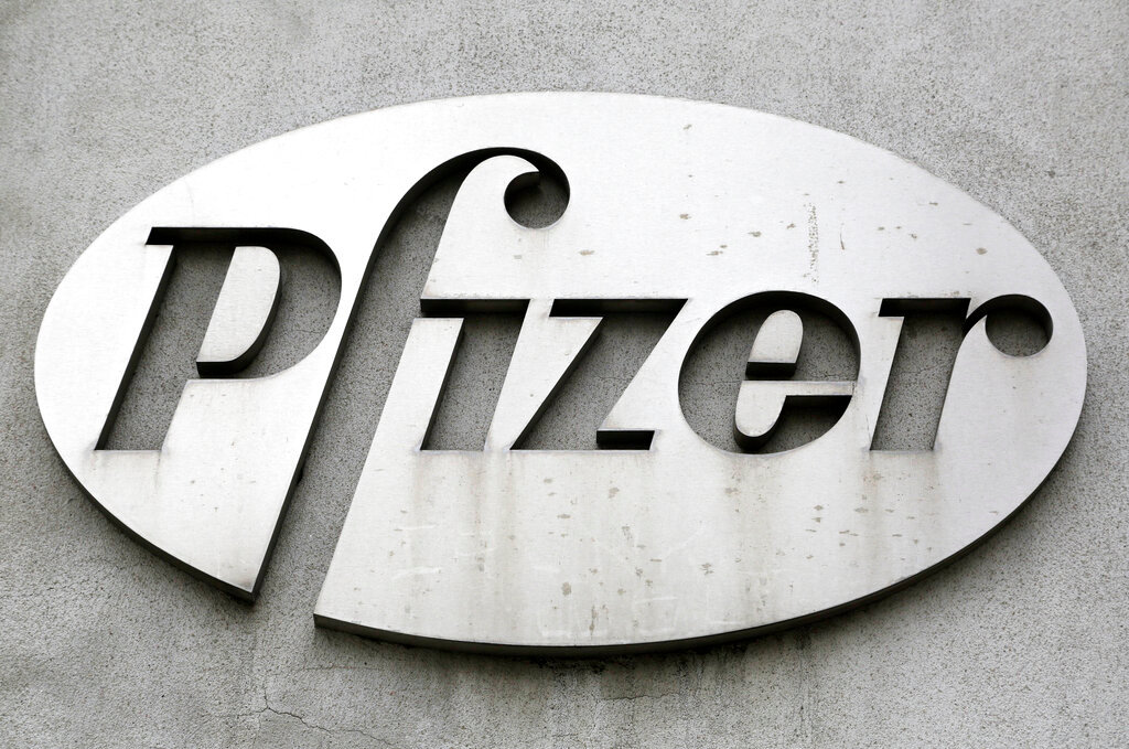 The Pfizer logo is displayed on the exterior of a former Pfizer factory, on May 4, 2014, in the Brooklyn borough of New York. (AP Photo/Mark Lennihan, File)