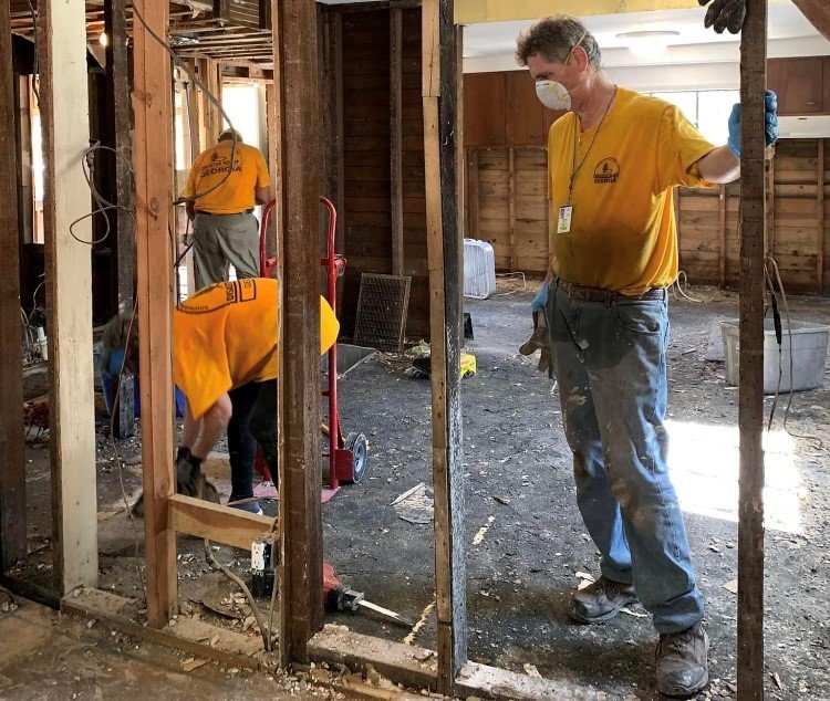 A team of Georgia Baptist Disaster Relief volunteers remove soggy drywall from a Kentucky home damaged by flash flooding.