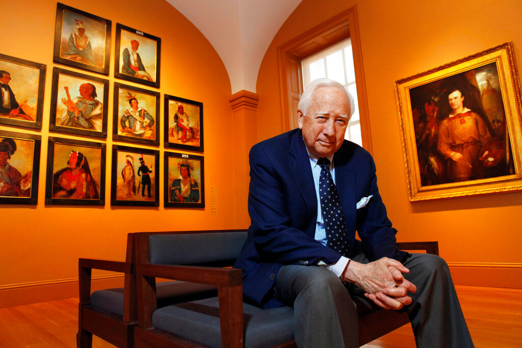 Historian and author David McCullough poses with art by George Catlin, one of the artists featured in his new book, "The Greater Journey," at the National Portrait Gallery, in Washington on May 13, 2011. (AP Photo/Jacquelyn Martin, File)
