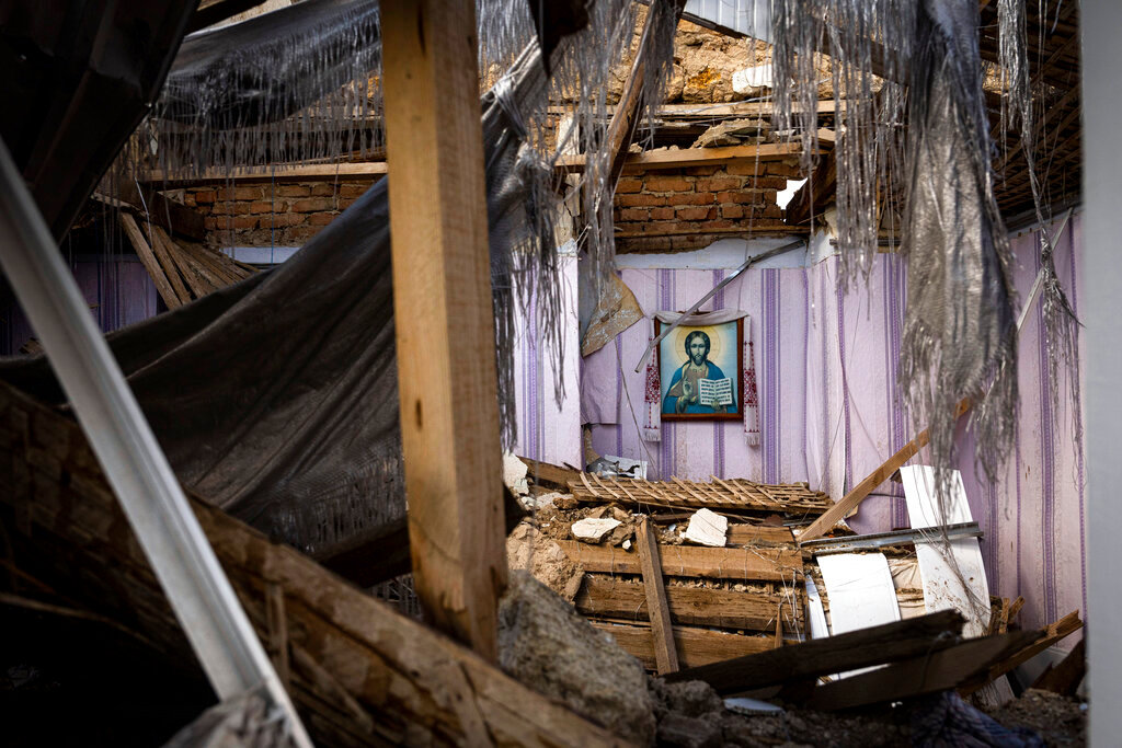 A religious icon is seen from the window of a church that was destroyed after a Russian attack at the frontline in Mykolaiv region, Ukraine, Monday, Aug. 8, 2022. (AP Photo/Evgeniy Maloletka)