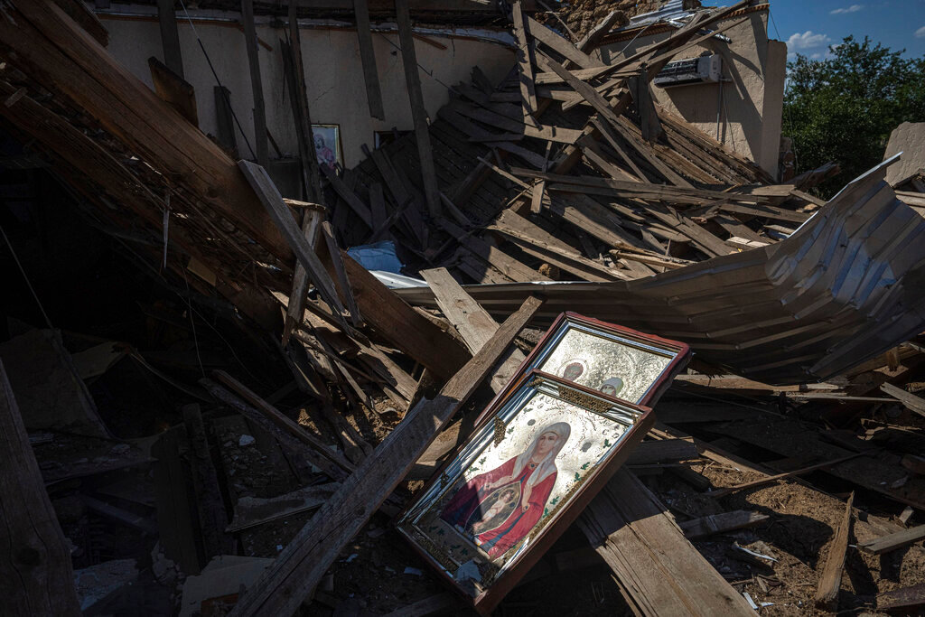 Icons lay on the debris of a church that was destroyed after a Russian attack at the frontline in Mykolaiv region, Ukraine, Monday, Aug. 8, 2022. (AP Photo/Evgeniy Maloletka)