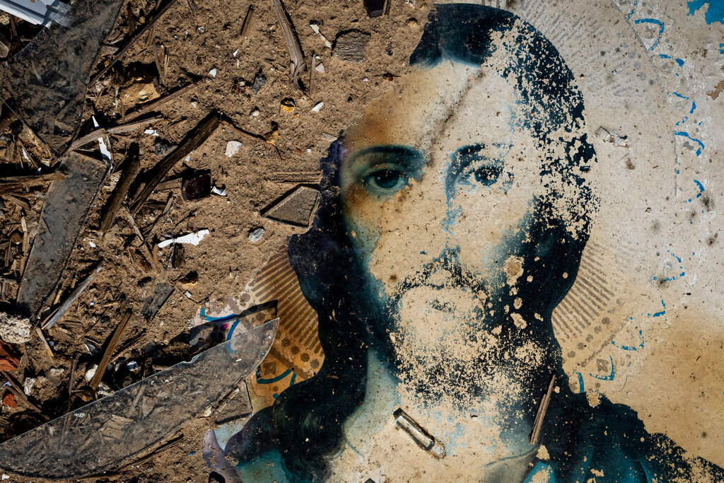An icon lies in the debris of a church that was destroyed after a Russian attack at the frontline in Mykolaiv region, Ukraine, Monday, Aug. 8, 2022. (AP Photo/Evgeniy Maloletka)