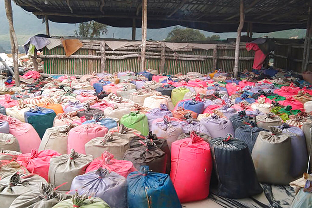 Sacks of rare earth ore in Kachin, Myanmar, waiting for transport to China. Tracing the supply chains for rare earths is complicated because they go through many layers of processing before ending up in a high-tech product. (Global Witness via AP)