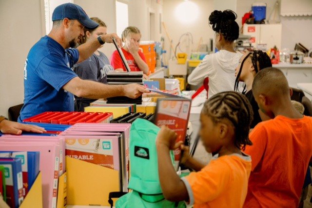 Volunteers from North Hills Church in West Monroe, La., pass out school supplies during a back-to-school bash on Saturday, Aug. 6. (Photo/Abby McCartney, North Hills Church)
