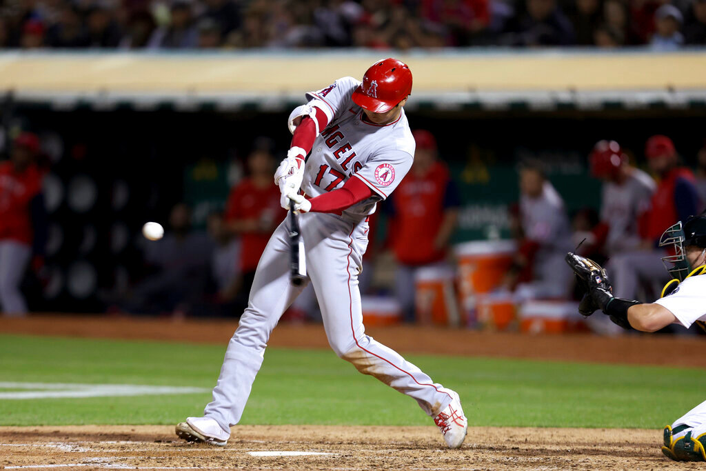 Los Angeles Angels' Shohei Ohtani hits a home run against the Oakland Athletics during the seventh inning in Oakland, Calif., Tuesday, Aug. 9, 2022. (AP Photo/Jed Jacobsohn)