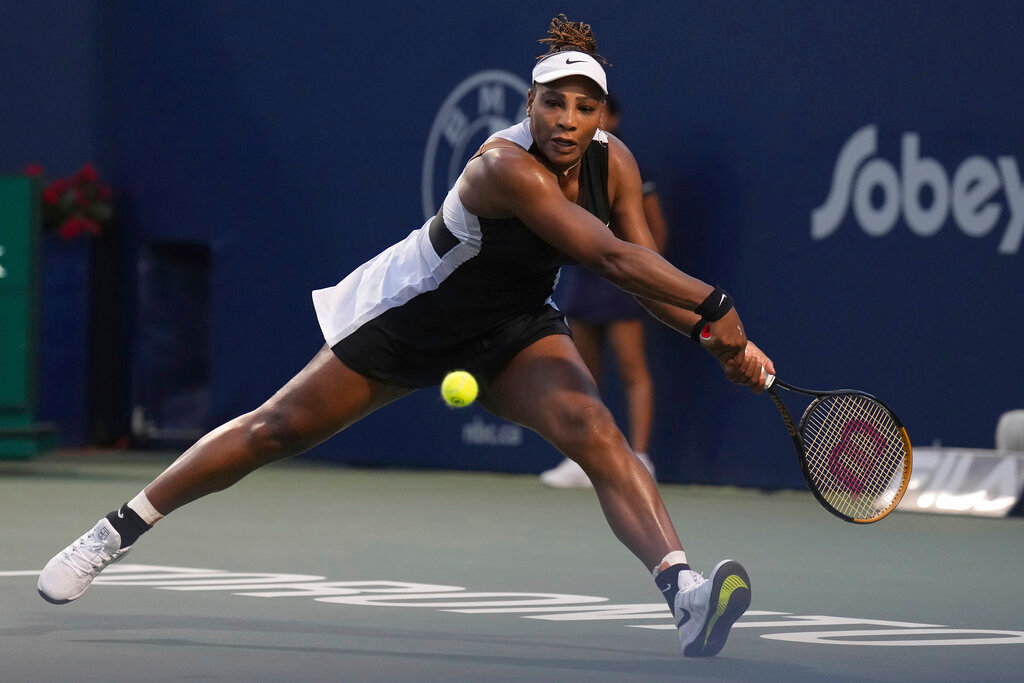 Serena Williams runs down a shot from Belinda Bencic, of Switzerland, during the National Bank Open tennis tournament Wednesday, Aug. 10, 2022, in Toronto. (Nathan Denette/The Canadian Press via AP)