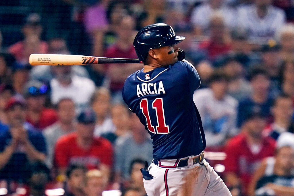 Atlanta Braves' Orlando Arcia hits an RBI single in the 10th inning against the Boston Red Sox, Tuesday, Aug. 9, 2022, in Boston. (AP Photo/Charles Krupa)