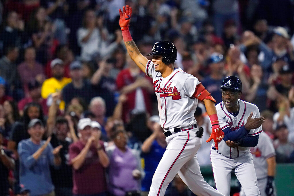 Atlanta Braves' Vaughn Grissom celebrates while running the bases on his two-run home run against the Boston Red Sox during the seventh inning Wednesday, Aug. 10, 2022, in Boston. At right is Braves third base coach Ron Washington. (AP Photo/Charles Krupa)