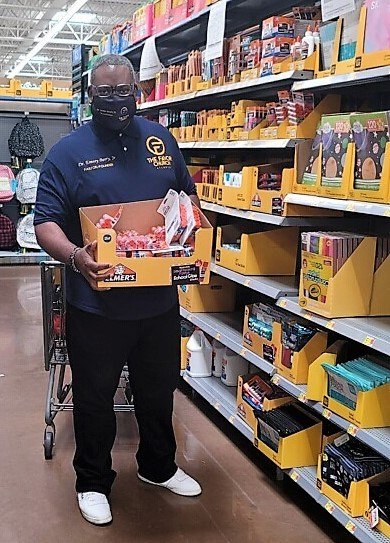 Emory Berry, founding pastor of The Favor Church in Decatur, Ga., buys supplies for a cookout the church hosted for the staff of Mary McLeod Bethune Middle School. (Submitted photo)