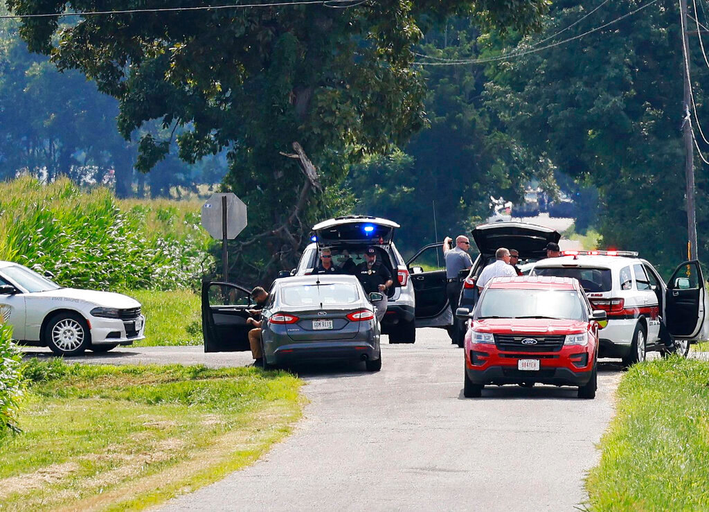 The area near Center and Smith roads was closed for hours during a standoff Thursday, Aug. 11, 2022, in Clinton County, Ohio, after an armed man tried to breach the FBI's Cincinnati office and fled north on the highway.  (Nick Graham/Dayton Daily News via AP)