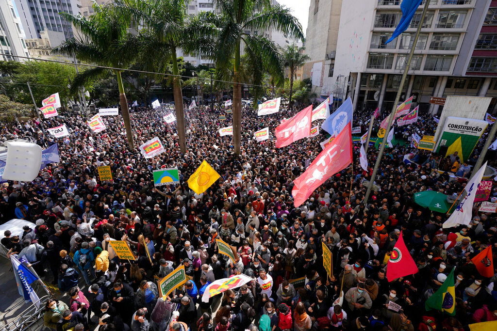 People gather for the reading of one of two manifestos defending the nation's democratic institutions and electronic voting system outside the Faculty of Law at Sao Paulo University in Sao Paulo, Brazil, Thursday, Aug. 11, 2022. (AP Photo/Andre Penner)