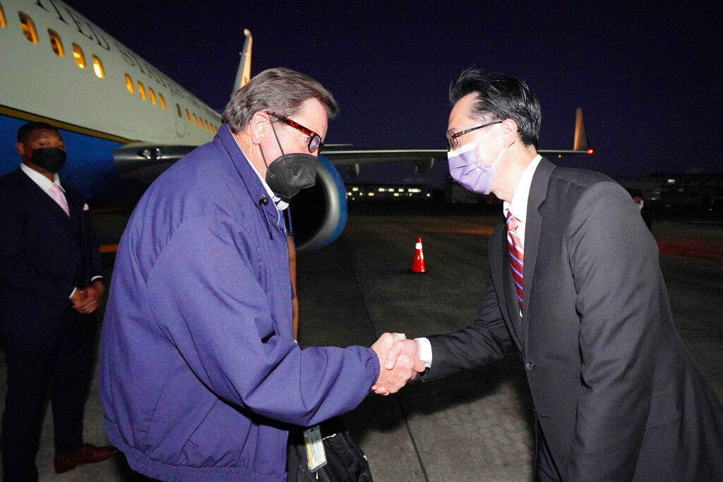 U.S. Democratic House member John Garamendi shakes hands with Donald Yu-Tien Hsu, Director-General of the Department of North American Affairs of Taiwan's Ministry of Foreign Affairs, after arriving on a U.S. government plane at Songshan airport in Taipei, Taiwan, Sunday, Aug 14, 2022. (Taiwan Ministry of Foreign Affairs via AP)