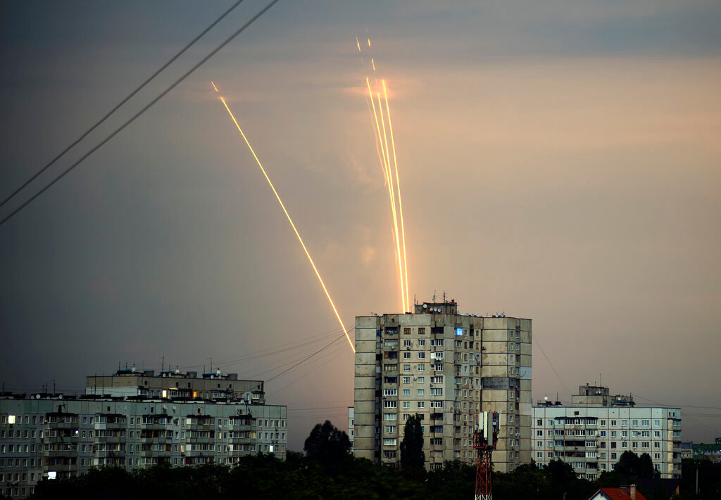 Russian rockets launch against Ukraine from Russia's Belgorod at dawn in Kharkiv, Ukraine, Monday, Aug. 15, 2022. (AP Photo/Vadim Belikov)