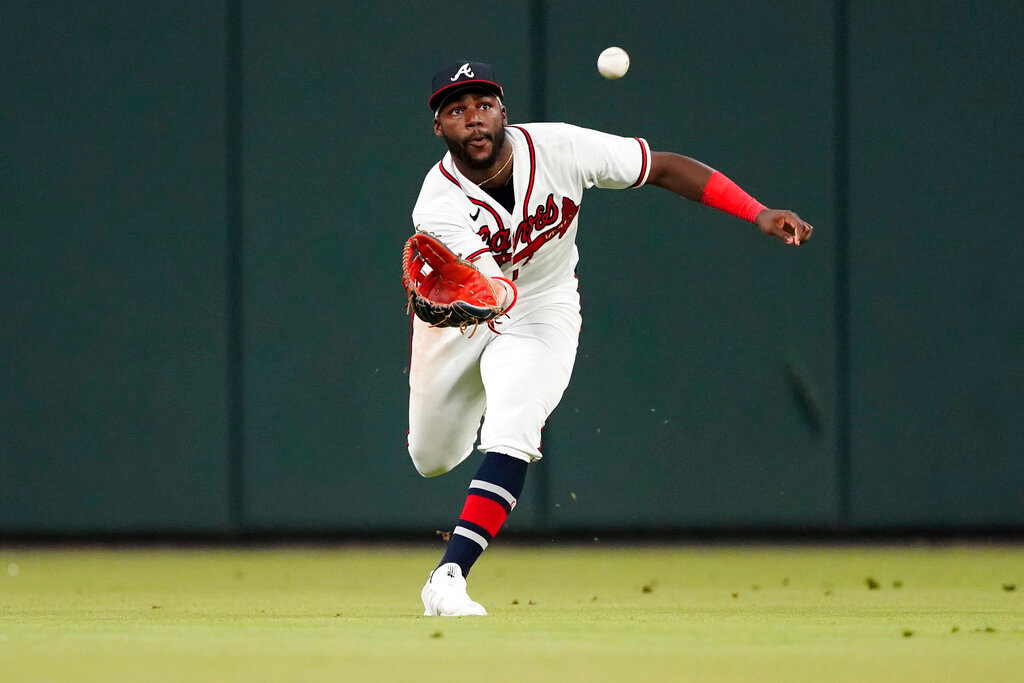 Atlanta Braves center fielder Michael Harris II makes a running catch on a fly ball from New York Mets Jon Berti in the eighth inning against the New York Mets Monday, Aug. 15, 2022, in Atlanta. (AP Photo/John Bazemore)