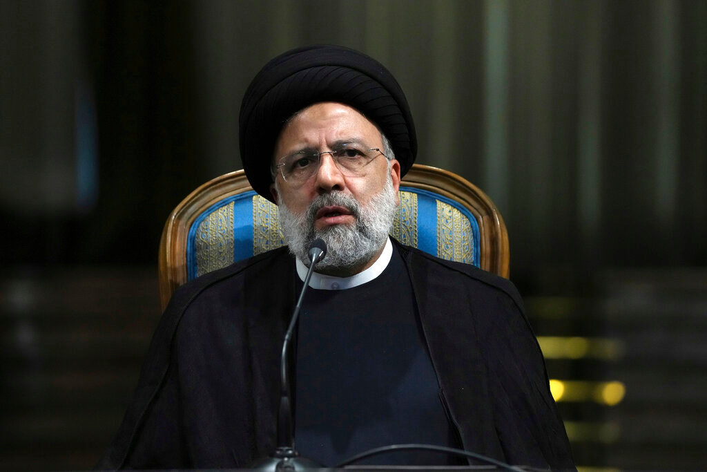 Iranian President Ebrahim Raisi speaks in a news briefing in Tehran, Iran, June 11, 2022. (AP Photo/Vahid Salemi, File)