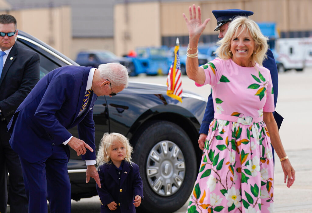President Joe Biden looks at his grandson Beau Biden as first lady Jill Biden waves and walks to board Air Force One at Andrews Air Force Base, Md., Aug. 10, 2022. (AP Photo/Manuel Balce Ceneta, File)
