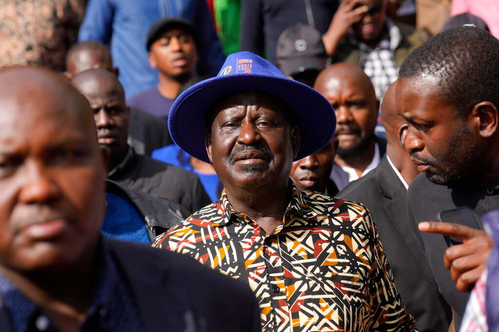 Kenyan presidential candidate Raila Odinga, center, departs after delivering an address to the nation at his campaign headquarters in downtown Nairobi, Kenya, Tuesday, Aug. 16, 2022. (AP Photo/Ben Curtis)