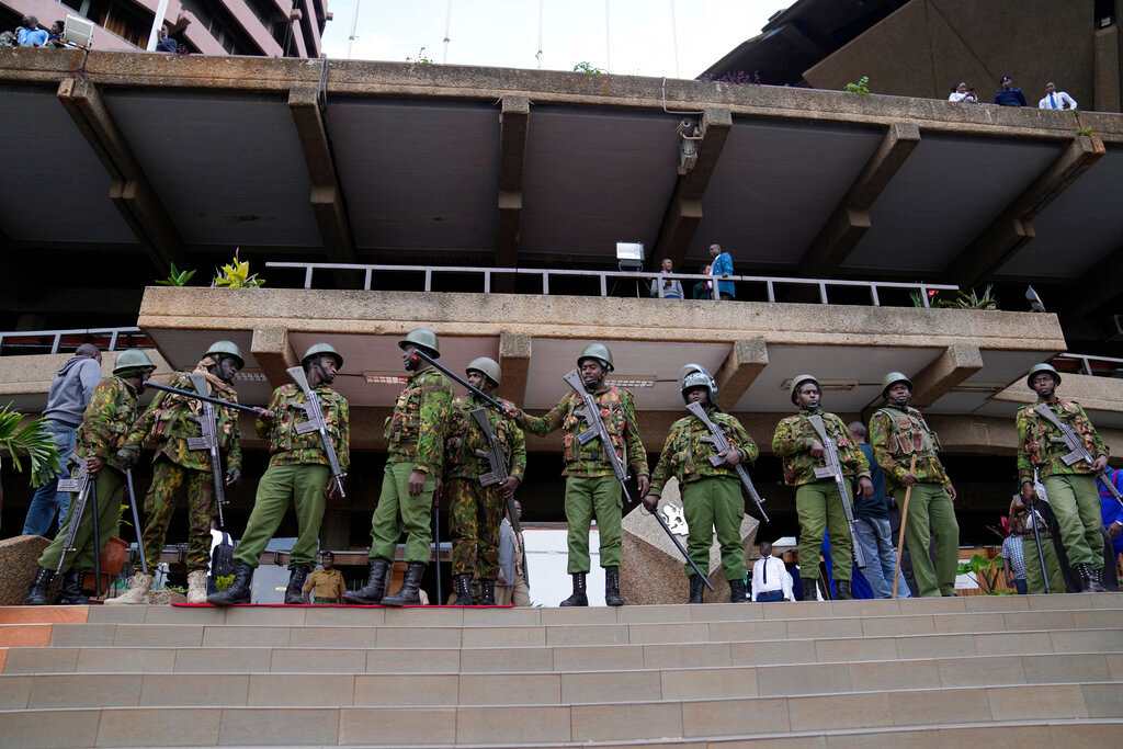 Soldiers stand outside the campaign headquarters of Kenyan presidential candidate Raila Odinga in downtown Nairobi, Kenya, Tuesday, Aug. 16, 2022. (AP Photo/Mosa'ab Elshamy)