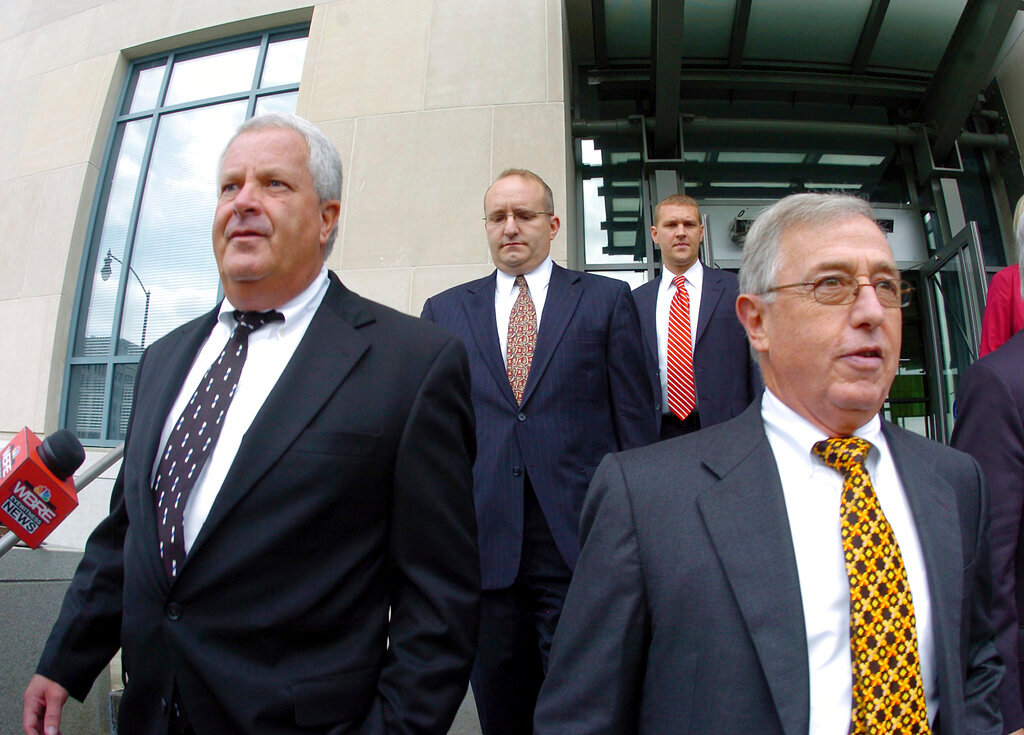 Former Luzerne County Court Judges Michael Conahan, front left, and Mark Ciavarella, front right, leave the United States District Courthouse in Scranton, Pa., Sept. 15, 2009. The two Pennsylvania judges who orchestrated a scheme to send (Mark Moran/The Citizens' Voice via AP, File)